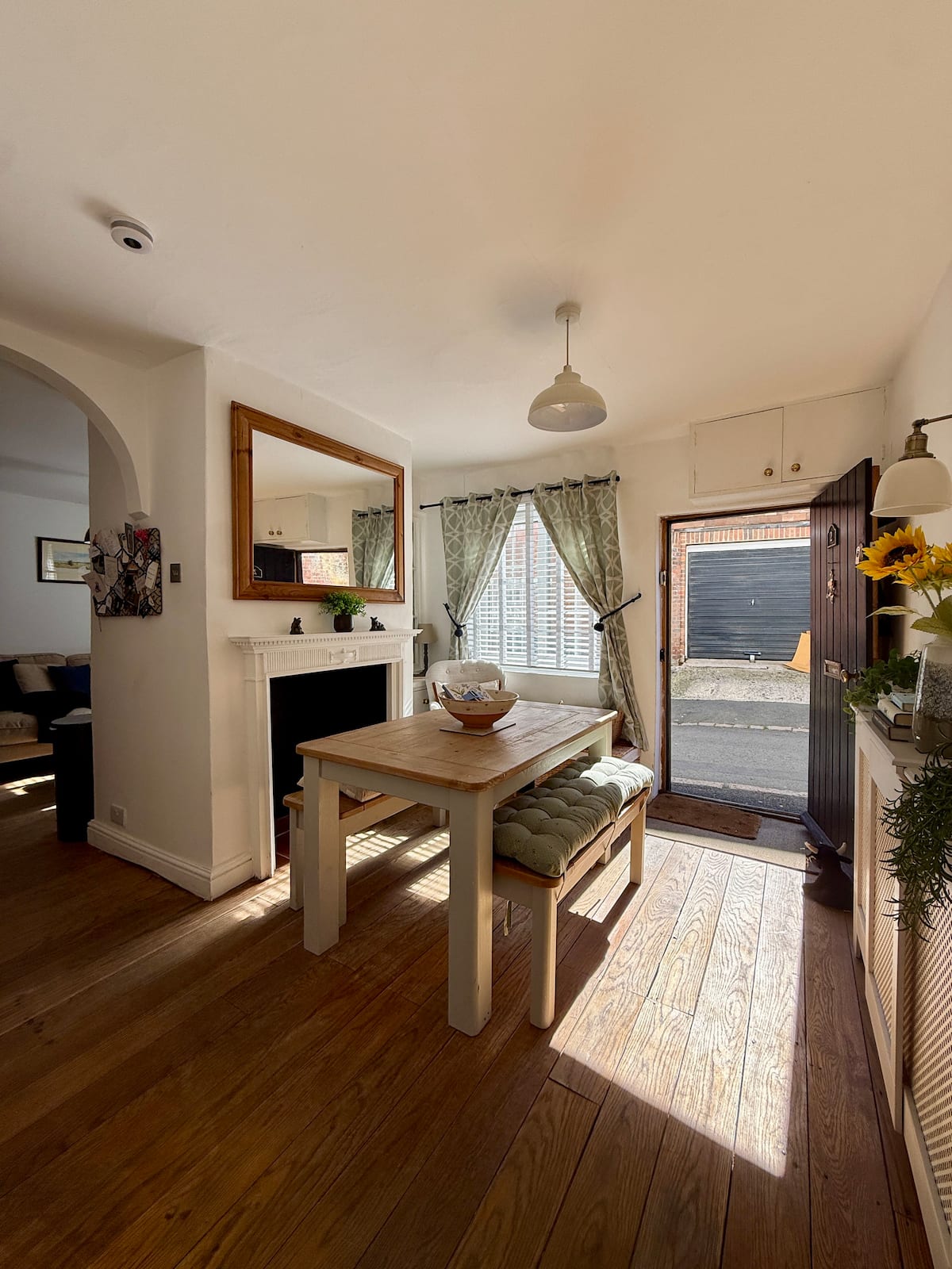 Bright dining area with oak table and garden door